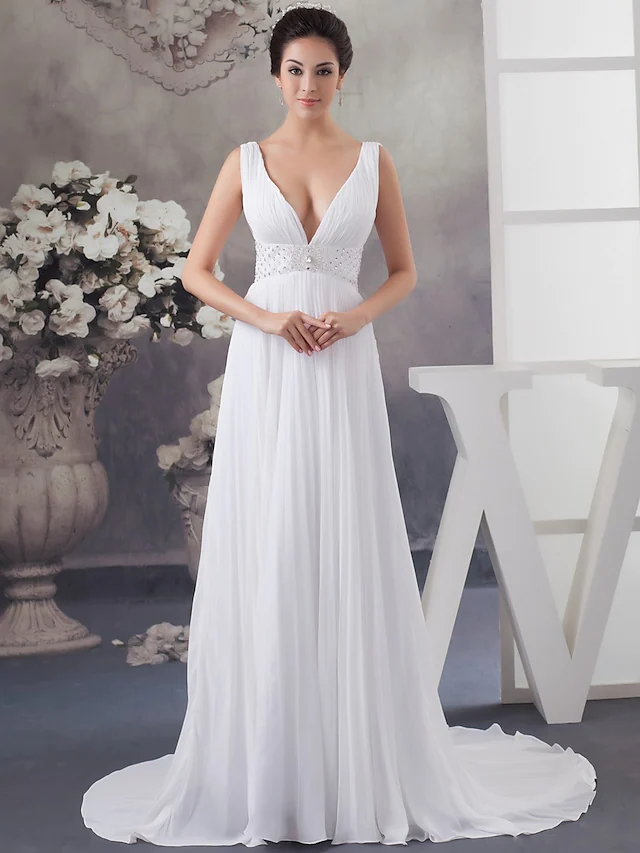 Elegant A-Line V-neck wedding dress with chapel train and crystal beading.