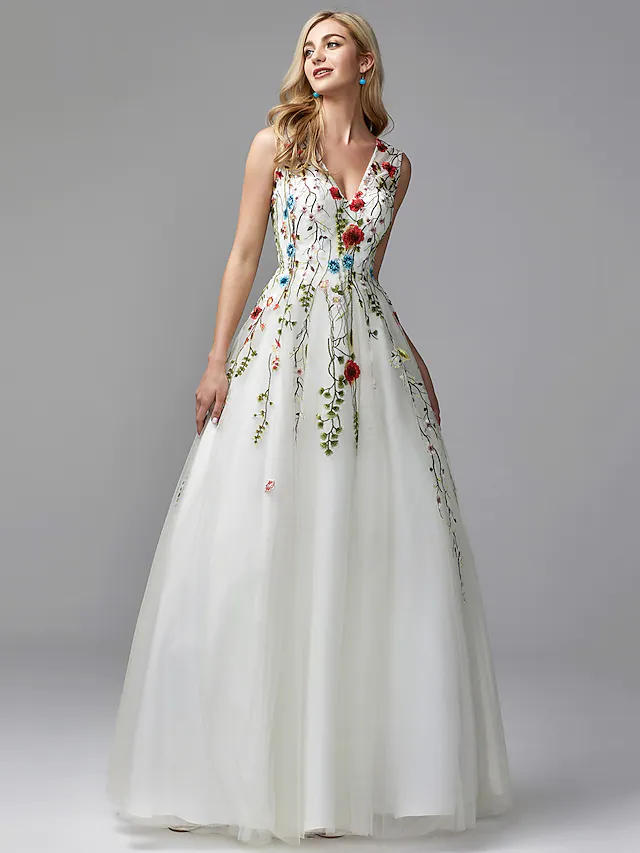 Front view of an elegant white A-line V-neck floral lace Quinceanera gown.