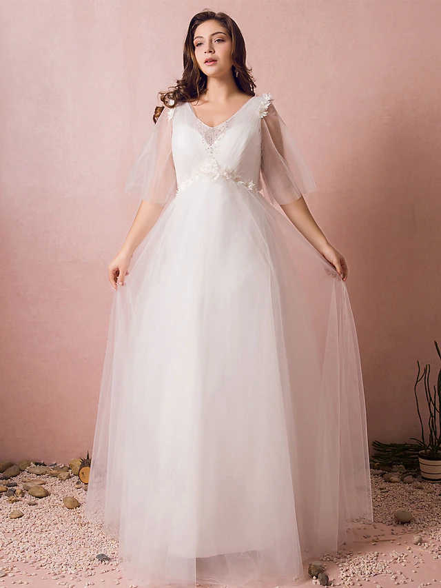 A-Line V-neck wedding dress with lace and half sleeves.
