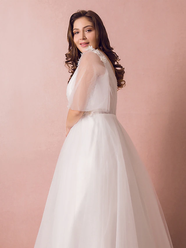 Back view of A-Line wedding dress showing floor-length skirt.