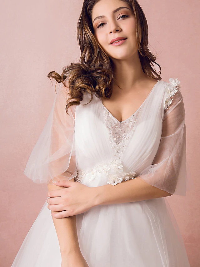 Side view of elegant A-Line bridal gown.