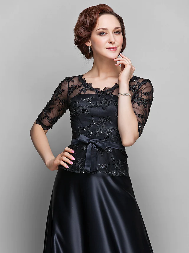 Detail of the sheer half sleeve with delicate lace and beading embellishments.