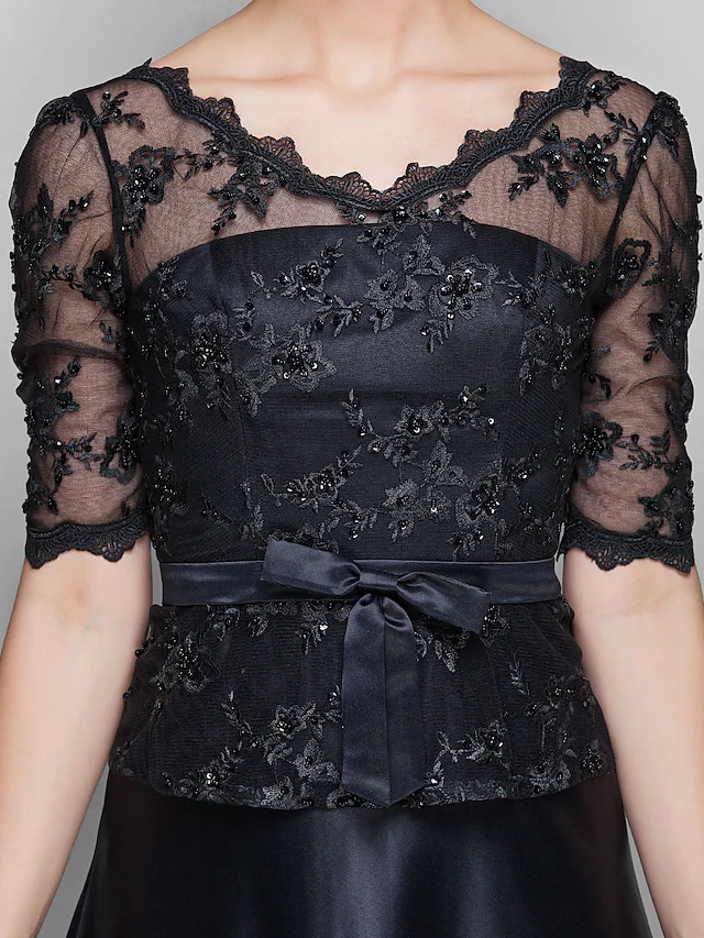Full length view of the A-Line Mother of the Bride dress from a slightly angled perspective.