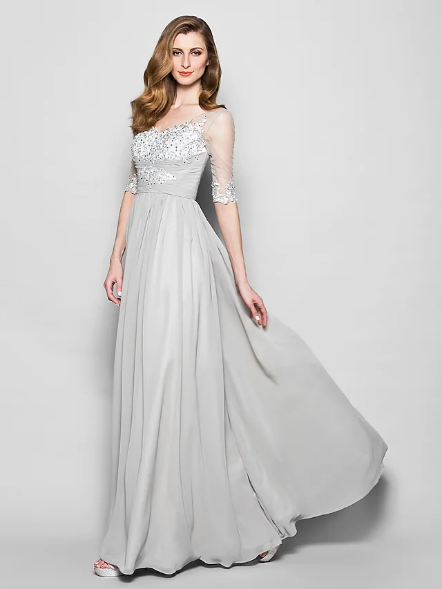Elegant A-line mother of the bride dress with V-neck, half sleeves, ruched bodice, and floor-length skirt.