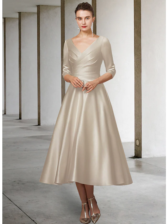 Back view of the A-line satin tea length dress, showing ruching details.