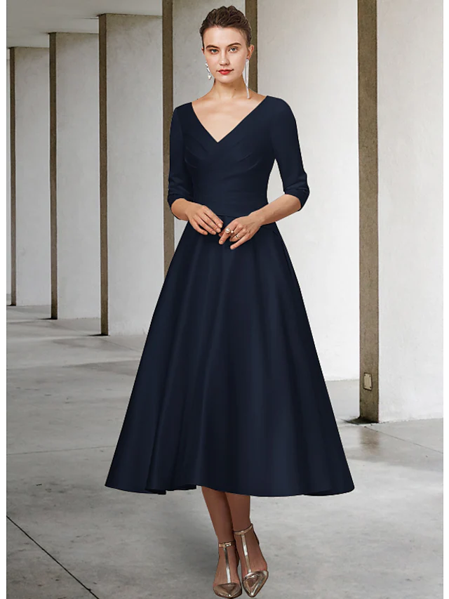 Close-up of the luxurious satin fabric and V-neckline on the A-line dress.