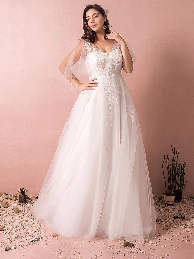 Front view of an elegant A-Line V-Neck half sleeve wedding dress with appliques and court train.