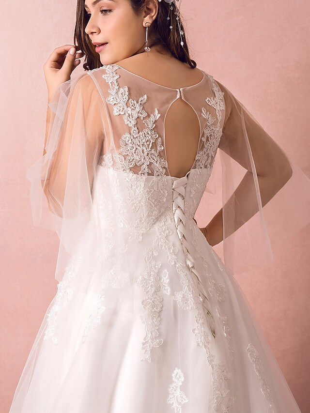 Full length view of the A-Line wedding dress, showing its elegant silhouette and train.