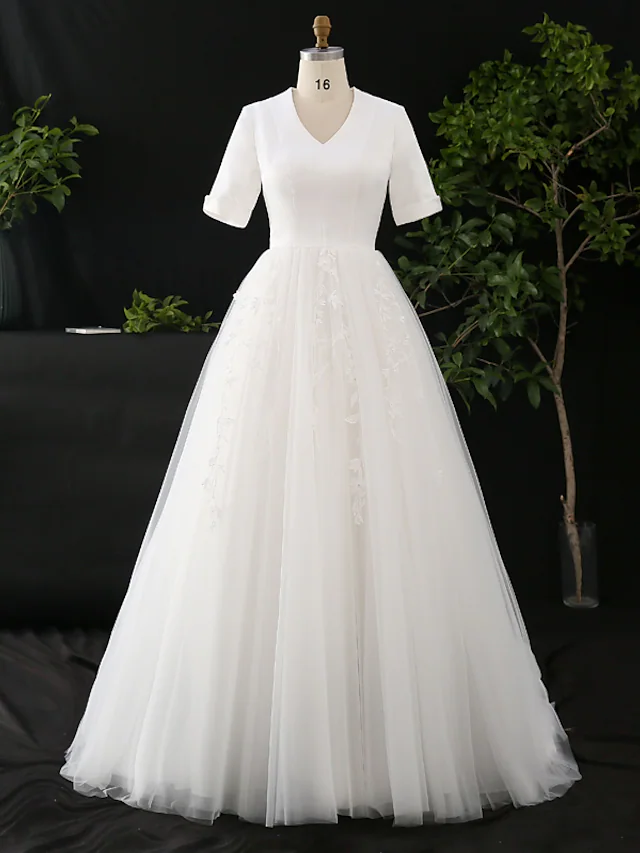 Front view of an elegant A-line wedding dress with V-neck and half sleeves.