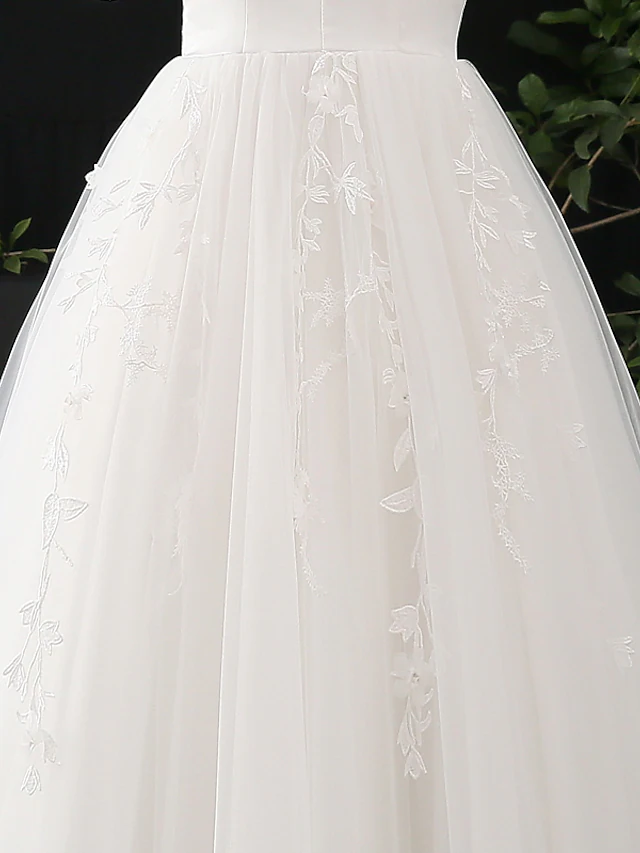 Another angle of the elegant A-line bridal gown with V-neck.