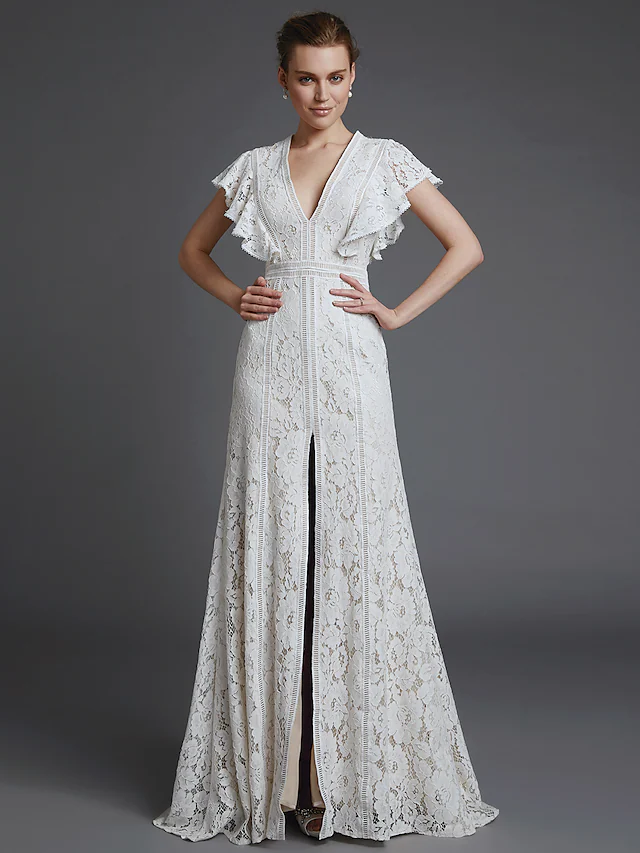 Close-up of lace detail on A-line V-neck wedding dress.