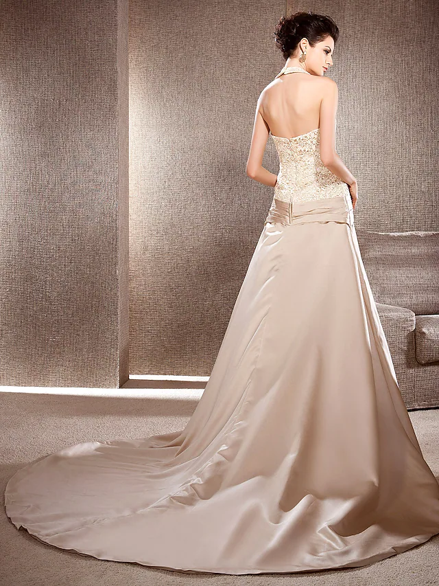 Back view of the A-line wedding dress, showcasing the chapel train and lace details.