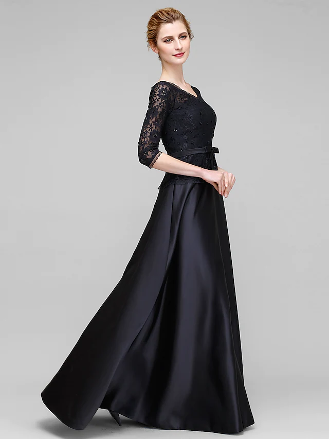 Full view of an elegant A-line V-neck mother of the bride dress with half sleeves and lace details.