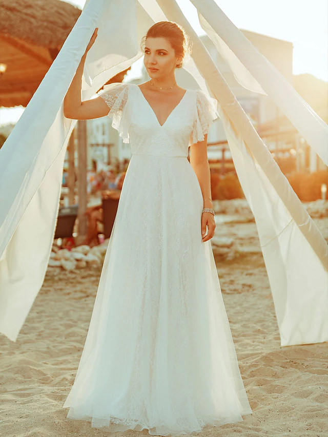 Front view of an A-line V-neck lace wedding dress with short sleeves.