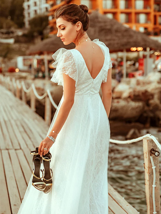 Back view of an A-line wedding dress featuring illusion lace detail.