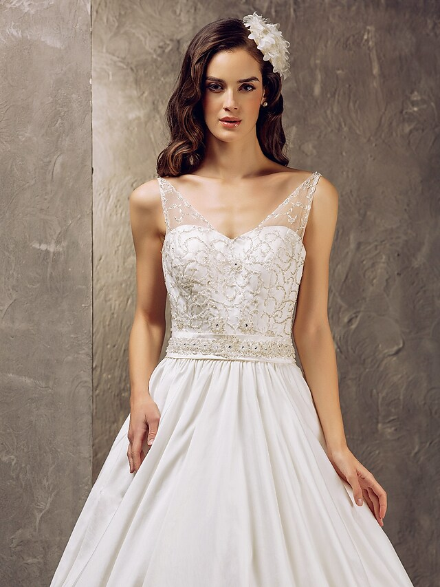 Side profile of a princess A-line wedding gown.