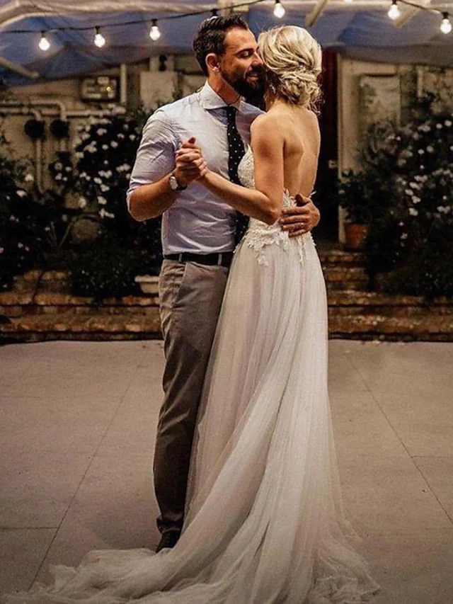 Full length view of the A-Line V-Neck wedding dress with a graceful sweep train.
