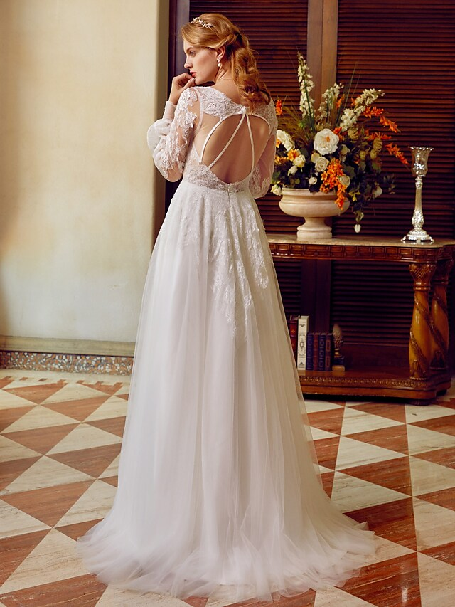 A-Line V-neck wedding dress with lace and tulle, featuring long sleeves and appliques.