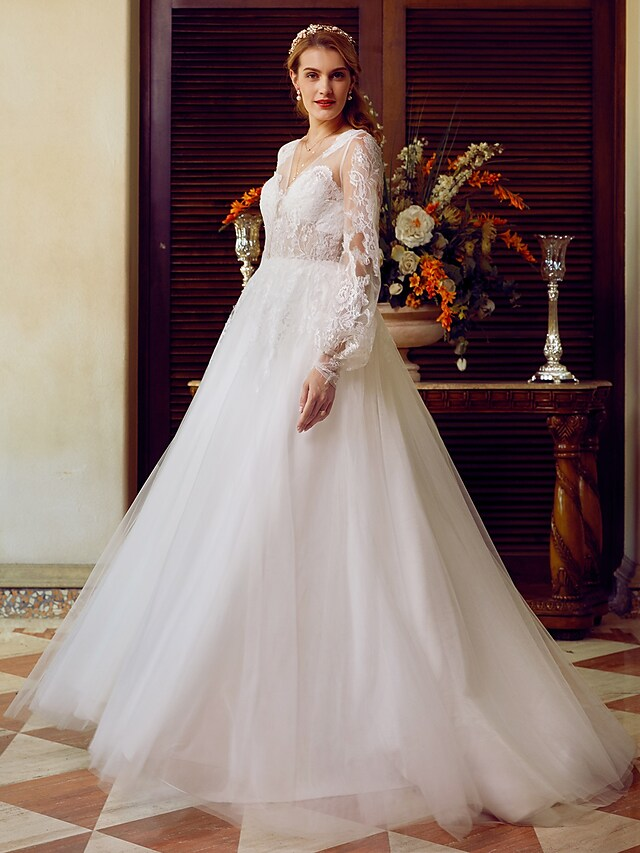 A-Line V-neck wedding dress with lace and tulle, featuring long sleeves and appliques.