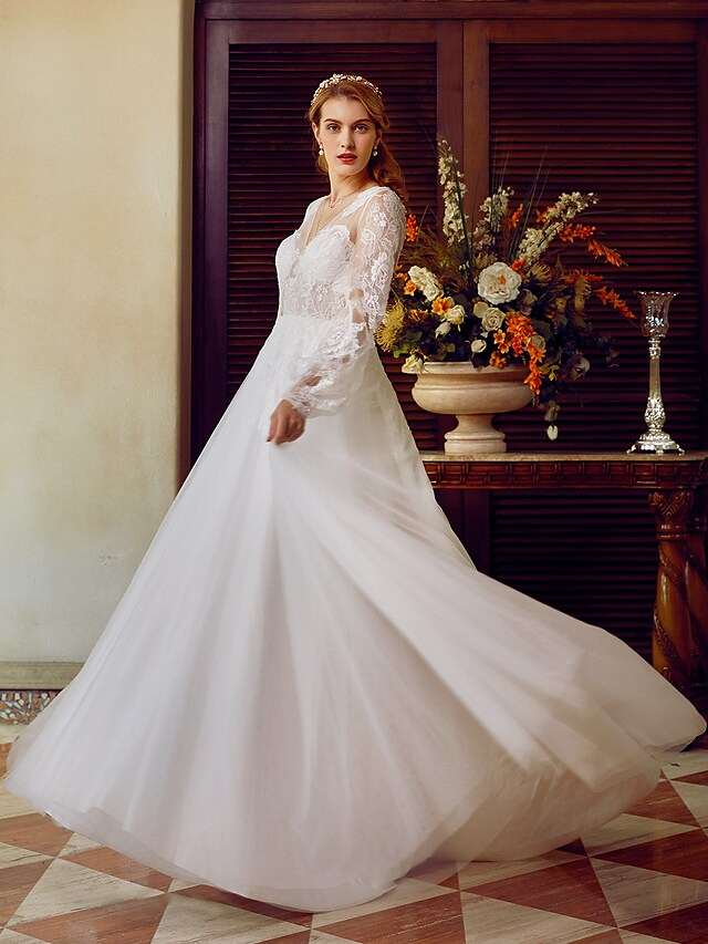 A-Line V-neck wedding dress with lace and tulle, featuring long sleeves and appliques.