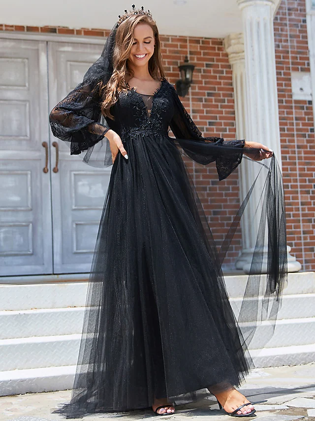 Close-up of the lace and tulle fabric on the black wedding dress.