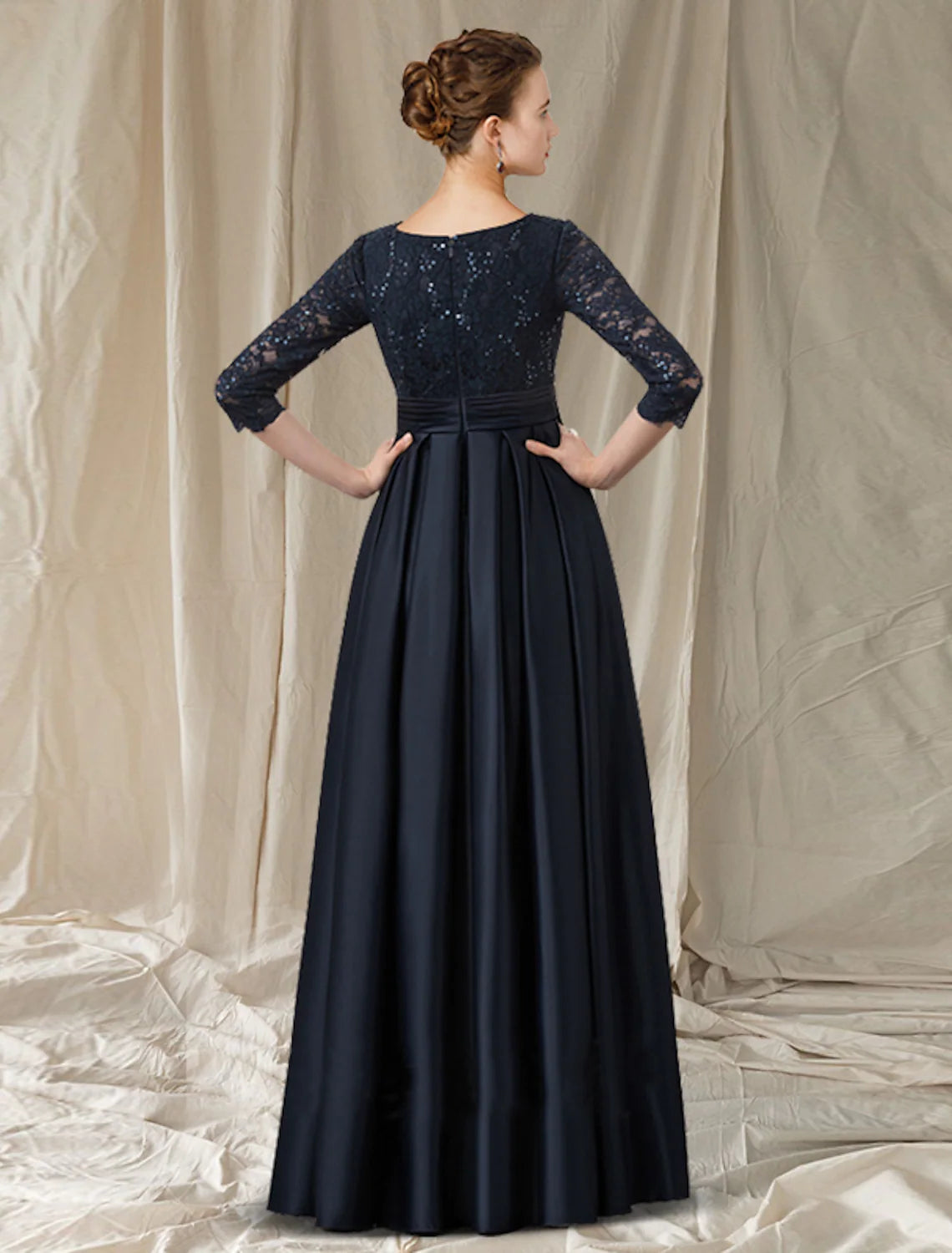 Floor-length A-line formal dress featuring lace details and bow accents.