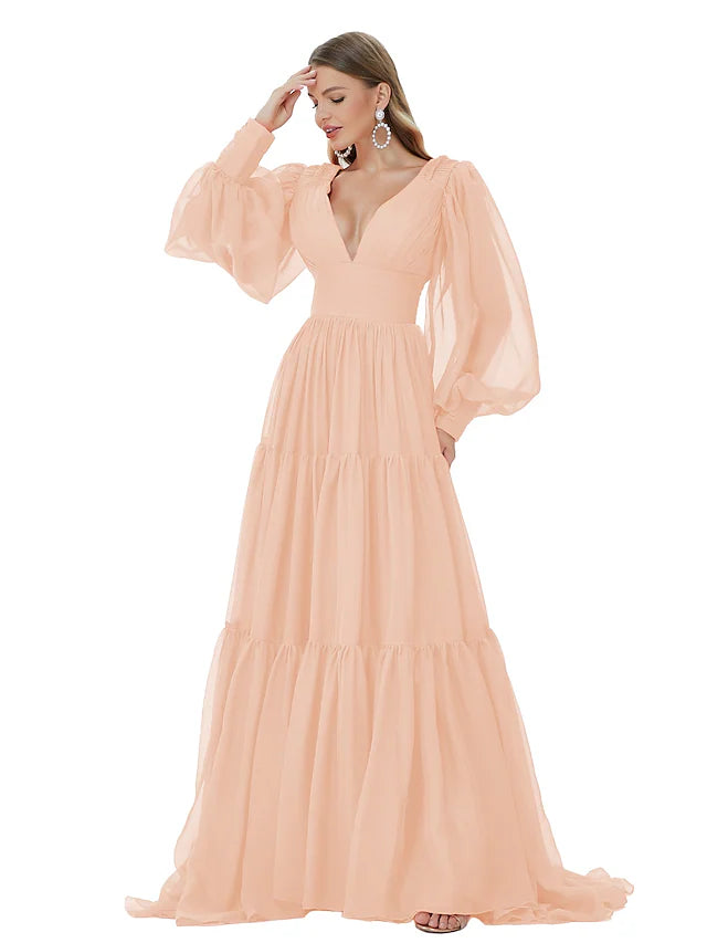 Close-up of the ruched detail on an A-line V-neck long sleeve chiffon evening gown.