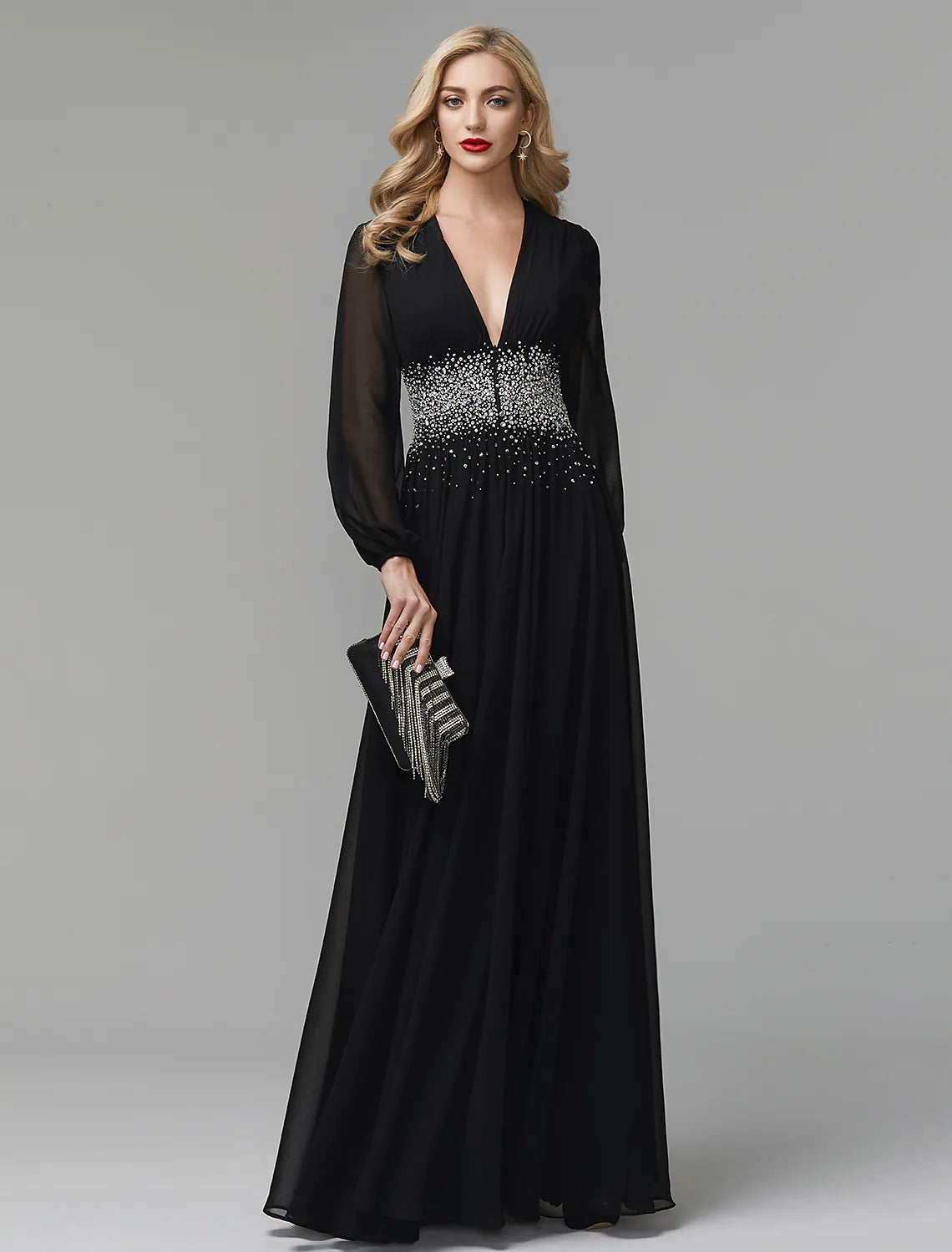 Back view of a black A-line formal gown with long sleeves.