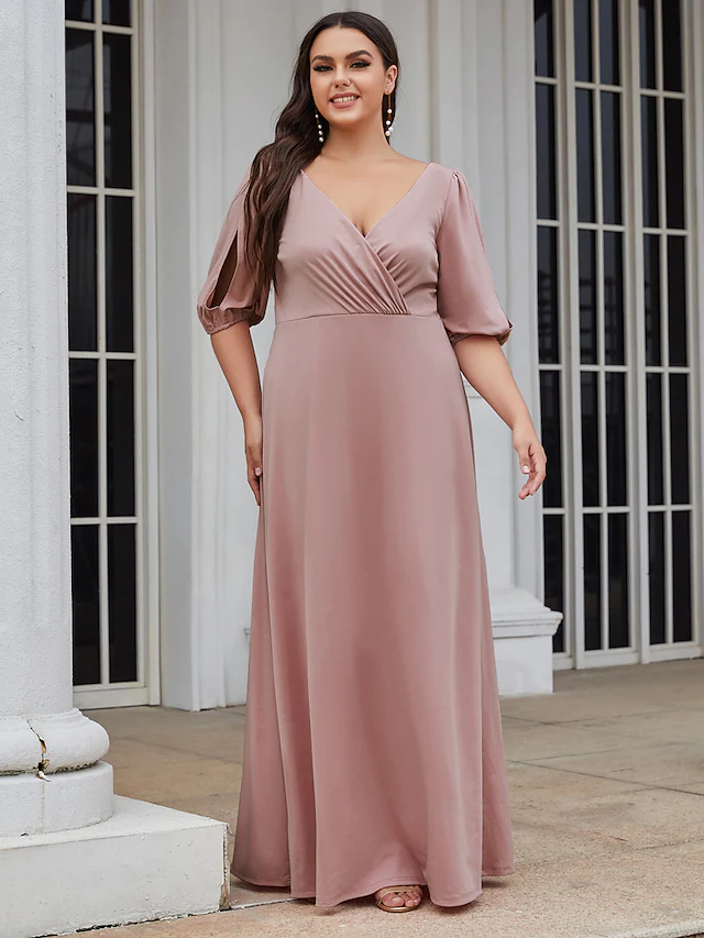 Close-up of the ruched bodice and V-neckline of the stretch satin dress.