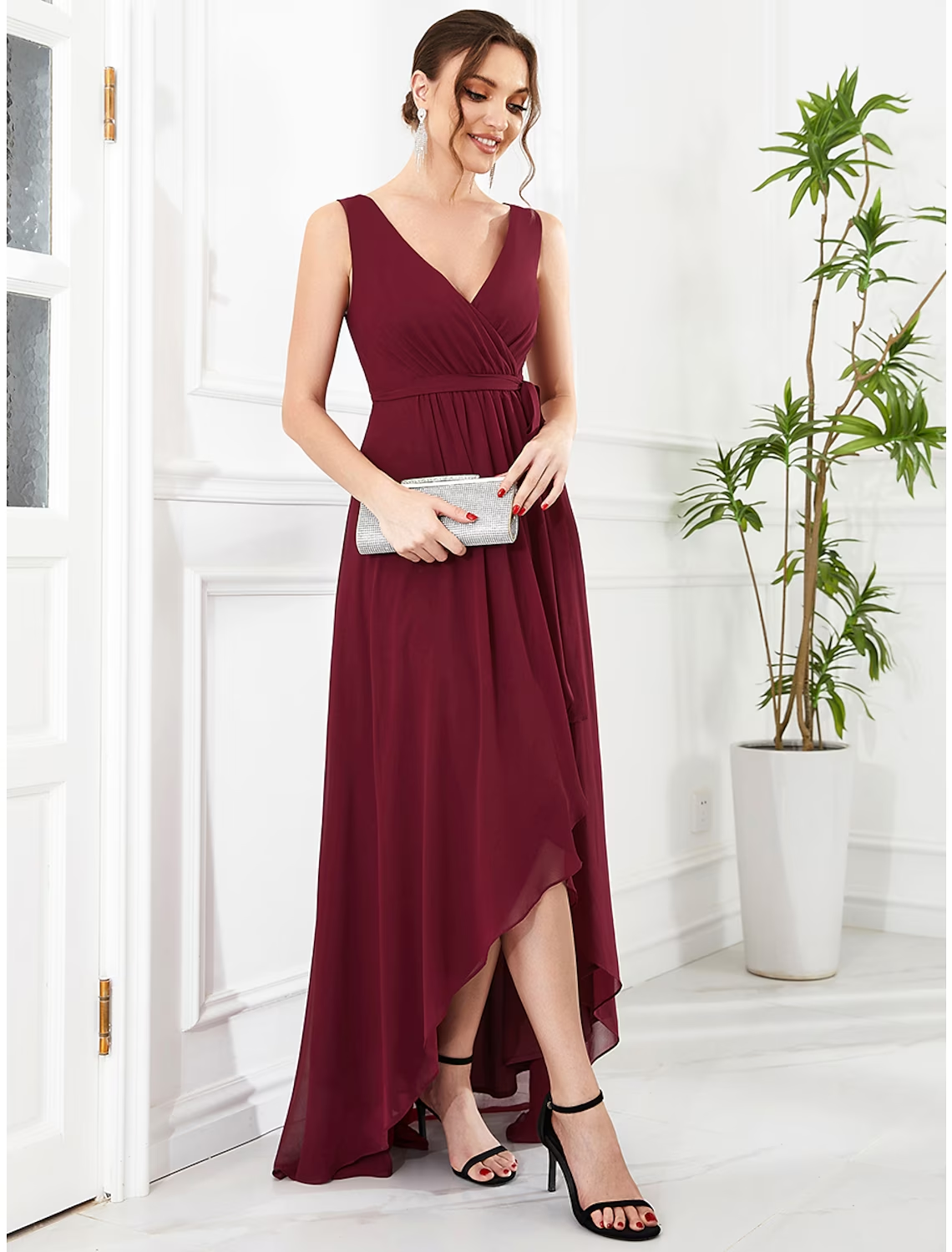 Model wearing a pink A-line V-neck ruffled chiffon dress with an asymmetrical hem.