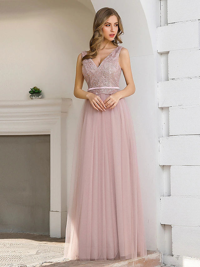 Sleeveless floor-length satin gown with a V-back and sash.