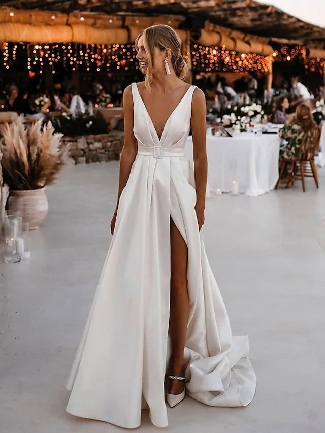 Elegant A-line V-neck satin wedding dress with a court train and split front.
