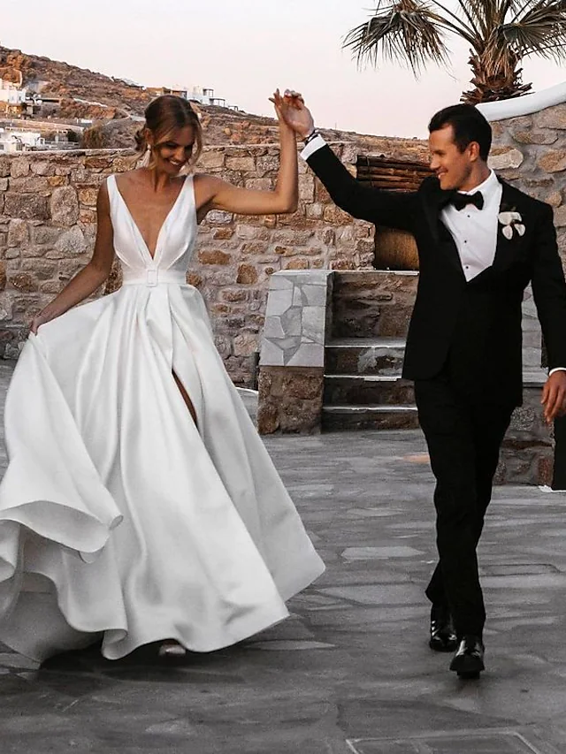 Back view of the A-line V-neck wedding dress, highlighting the court train.