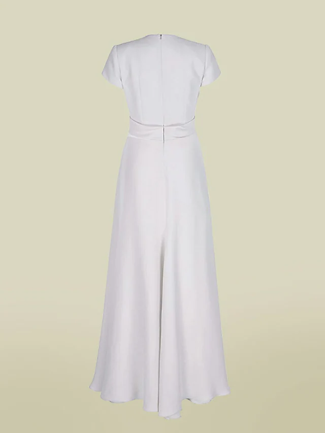 Floor-length charmeuse gown featuring delicate pleats and a flattering silhouette.