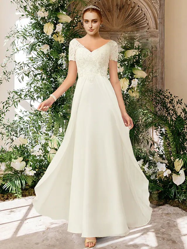 Front view of an A-Line V-neck wedding dress with short sleeves, chiffon and lace.