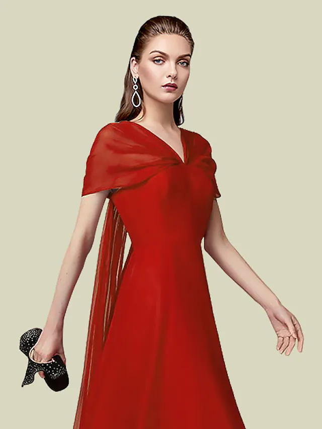 Close-up of the pleated detail and short sleeve on an A-line chiffon dress.