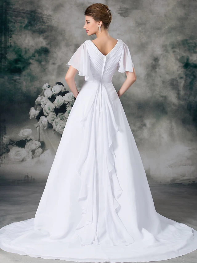 Close-up of V-neckline and short sleeves with beading on A-line wedding dress.