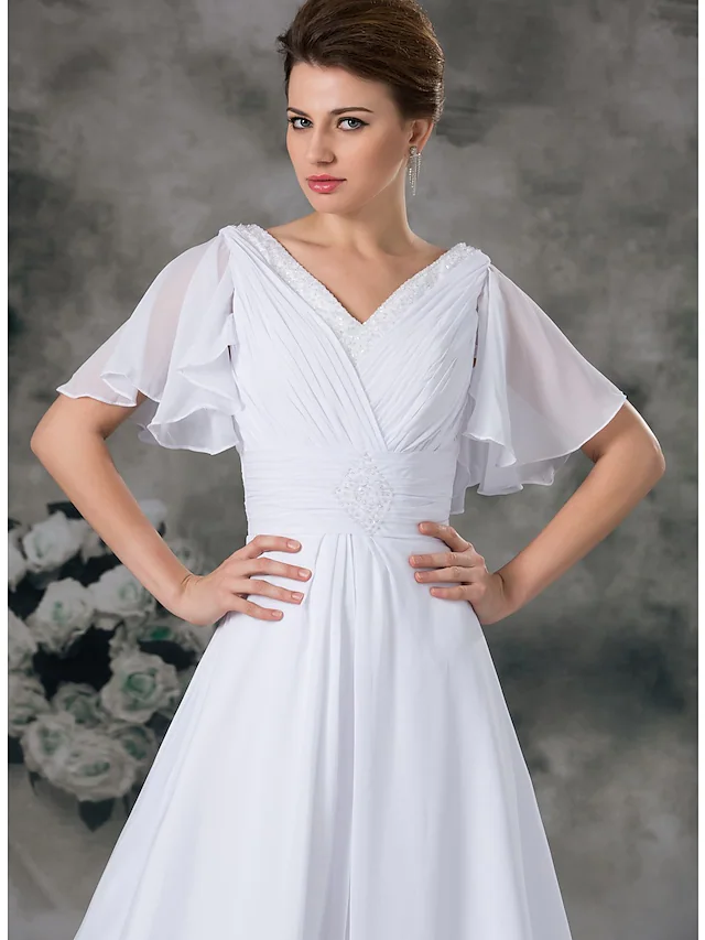 Side view of chiffon and satin A-line wedding dress.