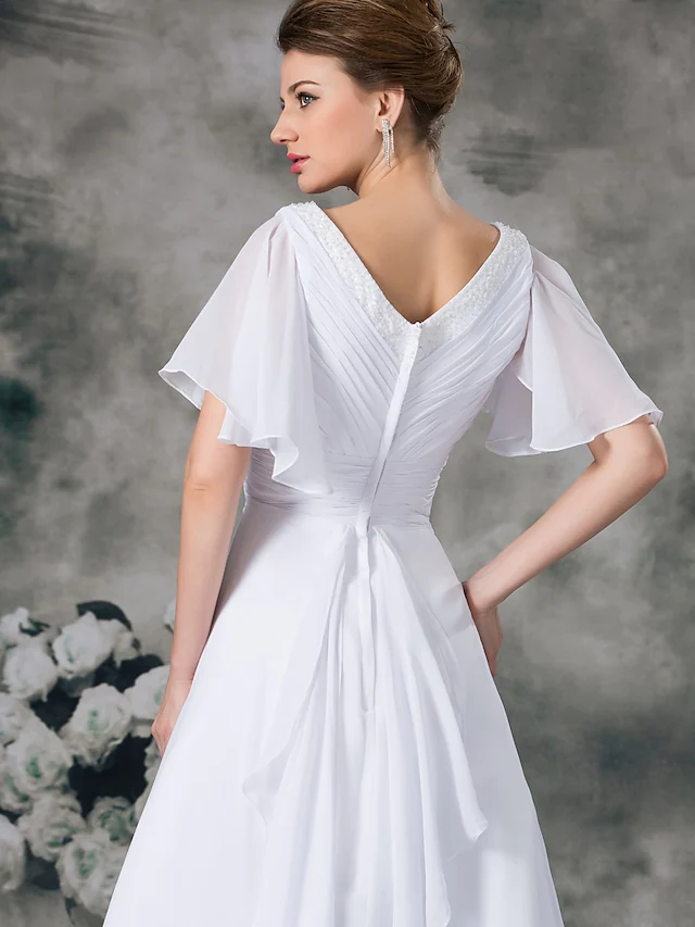 Full length view of elegant A-line bridal gown.