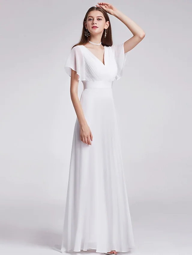 Back view of a floor-length white A-line wedding gown.