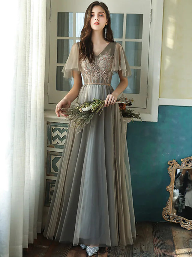 Elegant A-line V-neck bridesmaid dress with short sleeves, beading, and sequins.