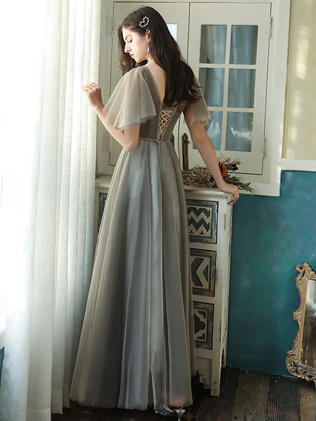 Back view of the A-line bridesmaid dress, showing the flowing tulle skirt.