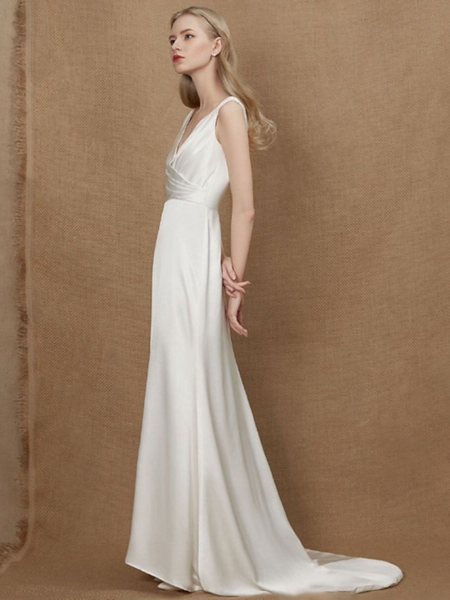 Elegant A-Line V-Neck charmeuse wedding dress with ruched detailing.
