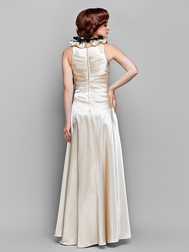 Side view of A-Line gown showing stretch satin fabric and side draping.