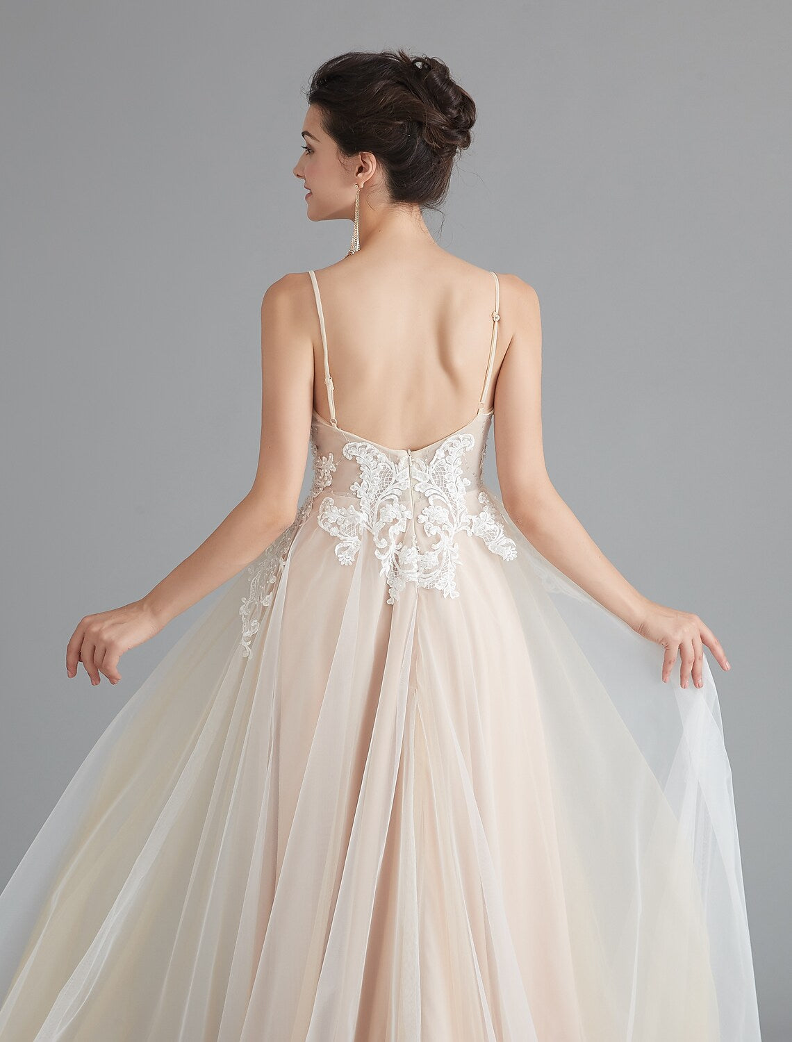 Side view of sleeveless A-line dress with delicate beading.