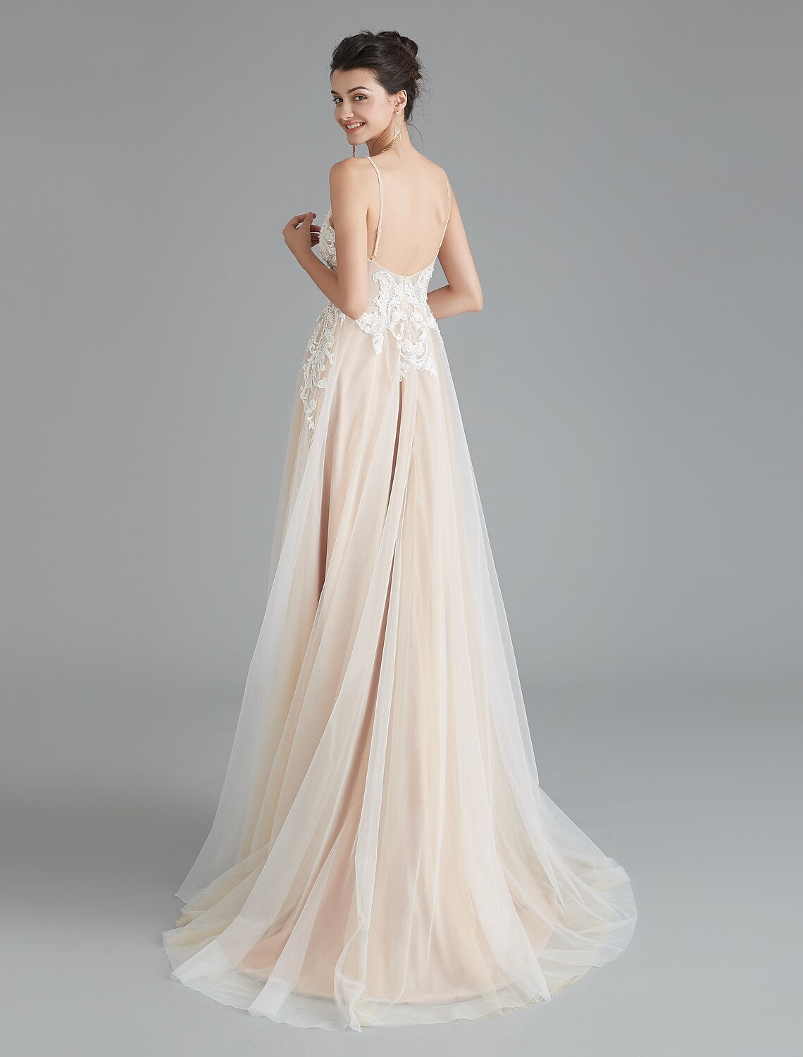 Model showcasing the flow of the A-line sweep train dress.