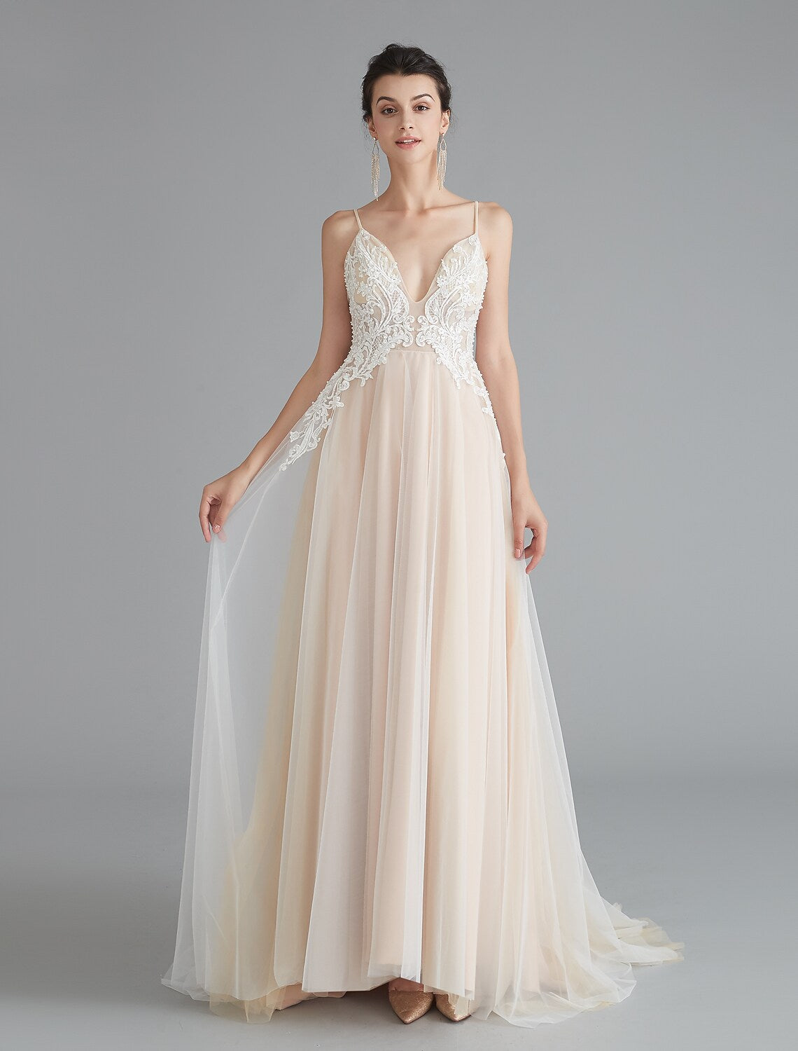 Full length view of a beautiful A-line V-neck formal gown.