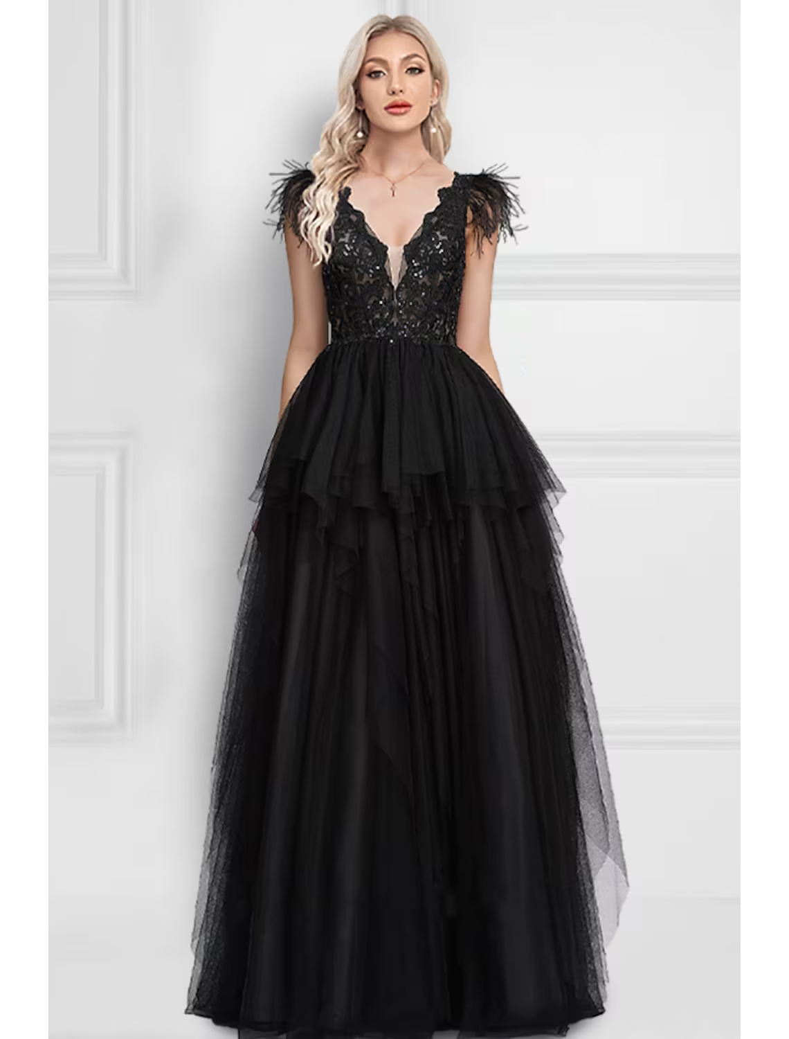 Black A-Line prom dress with V-neck, feather appliques, and floor-length tulle skirt.
