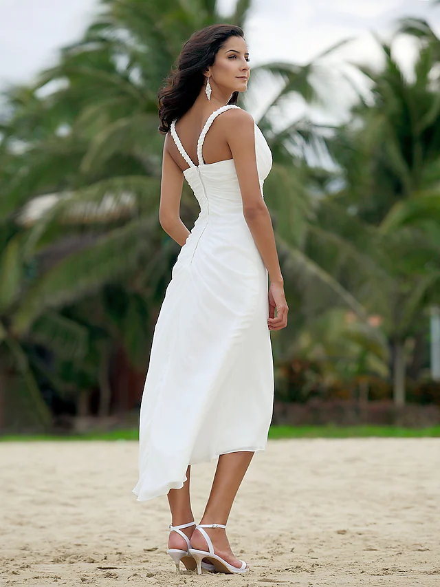 Full length view of the elegant V-neck bridal gown.
