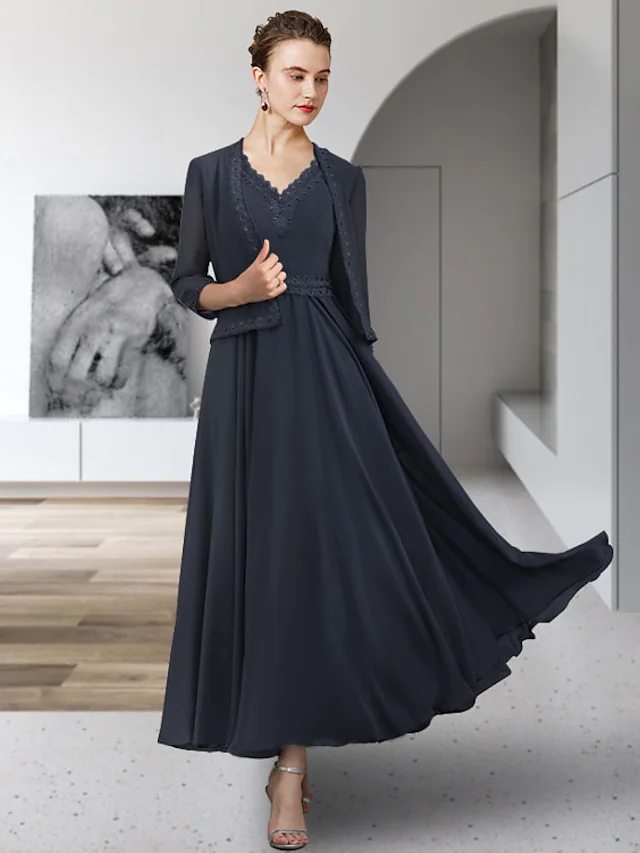 Elegant A-line mother of the bride dress in chiffon and lace with a V-neckline.